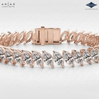 A close-up studio shot of a Lara Dutta Arias bracelet showing the rose gold clasp and the marquise-cut diamond links. The brand logos 'LARA DUTTA' and 'Sparkles' are visible in the top corners.