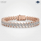 A rose gold tennis bracelet with marquise-cut clear stones, featuring a rectangular clasp and shown on a light gray background with ARIAS Lara Gutta and Sparkle logos.