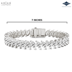 A silver tennis bracelet with pear-cut diamonds, shown on a white background with a dimension line indicating a length of 7 inches. The brand logos for Arias Lara Dutta and Sparkle are visible in the top corners.