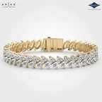 A yellow gold tennis bracelet featuring a row of marquise-cut clear gemstones, displayed on a light gray background with ARIAS Lara Gutta branding in the top left and a Sparkle certification badge in the top right.