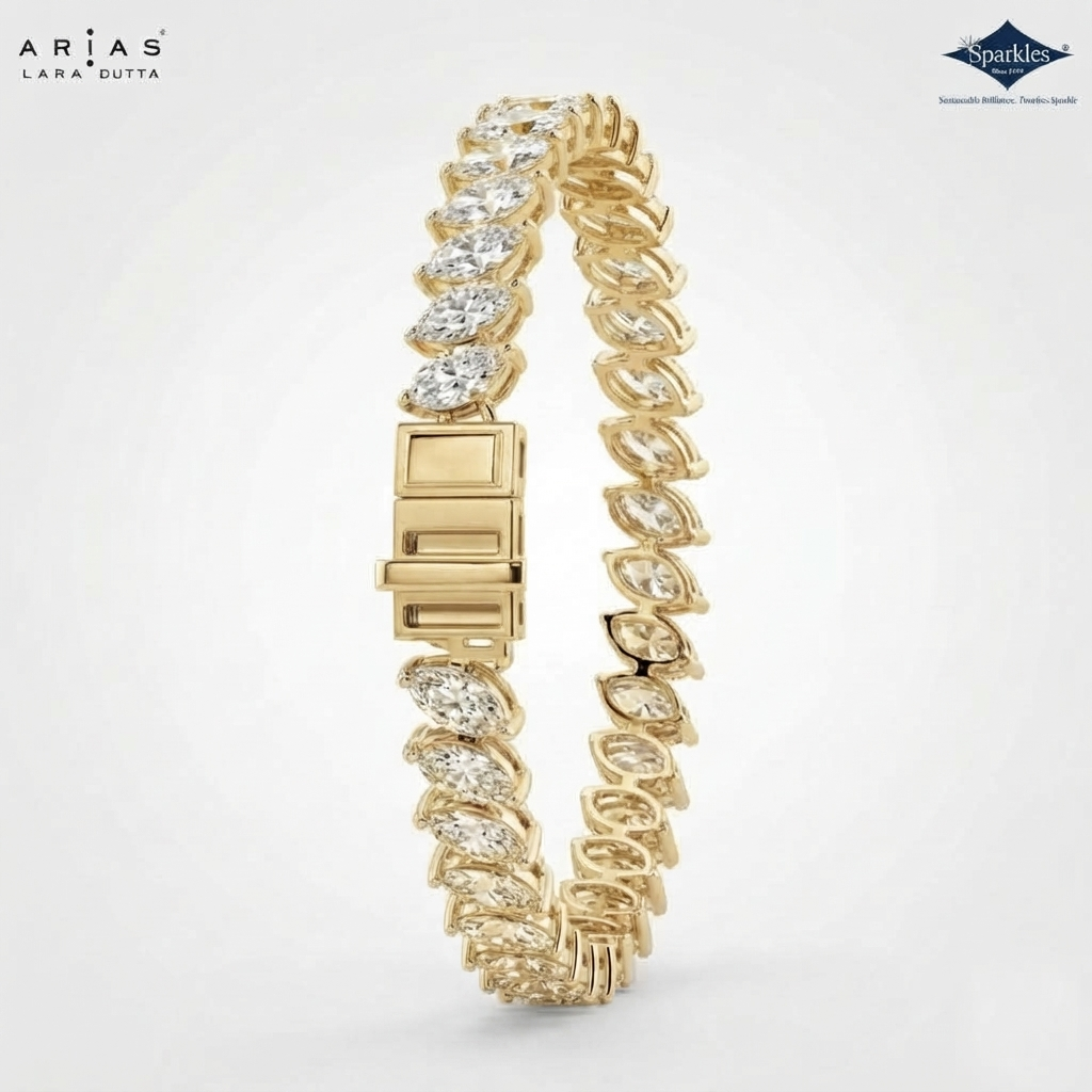 A gold tennis bracelet with marquise-cut clear stones, shown on a light gray background. The brand logos 'Arias Lara Gutta' and 'Sparkle' are visible in the corners.