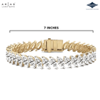 A yellow gold tennis bracelet with clear marquise-cut gemstones, shown on a white background with a dimension line indicating a length of 7 inches. The brand logos for Arias Lara Dutta and Sparkle are visible in the top corners.