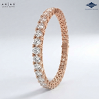 A rose gold tennis bracelet with a row of round brilliant-cut clear stones on one side, shown on a light gray gradient background. The ARIAS Lara Cutta logo is in the top-left corner, and the Sparkles gemstone brand logo is in the top-right.