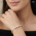 A close-up lifestyle shot of a model wearing a rose gold tennis bracelet adorned with sparkling clear round-cut gemstones. The brand logos for 'Ariane Lara' and 'Sparkles' are visible in the top corners.
