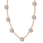 Rose gold necklace with diamond pendants on a white background