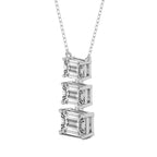 A silver necklace with a vertical stack of three baguette-cut clear gemstones in a silver setting, suspended from a delicate silver chain against a plain white background.