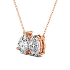Rose gold necklace with two pear-shaped diamonds on a white background
