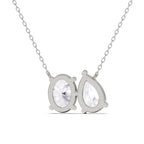 Silver necklace with two teardrop-shaped clear gemstones on a white background