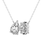 Diamond necklace with two pear-shaped and one oval-shaped gemstones on a white background