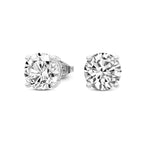 Pair of diamond stud earrings on a white background