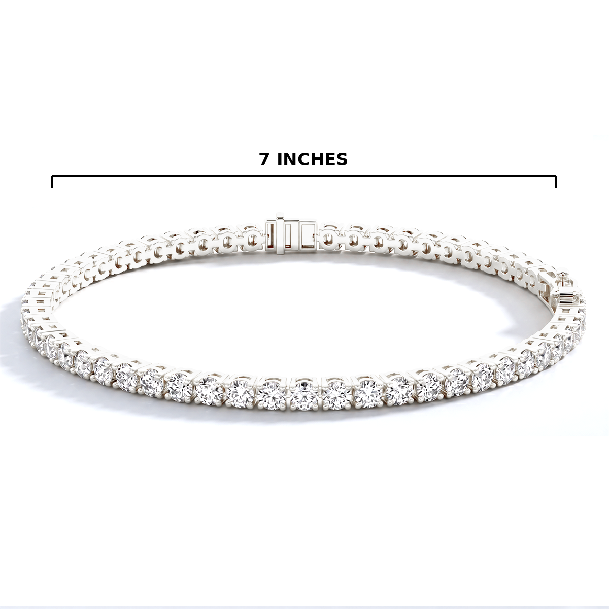 A silver tennis bracelet with clear stones, shown on a white background with a black measurement line above it labeled '7 INCHES'.