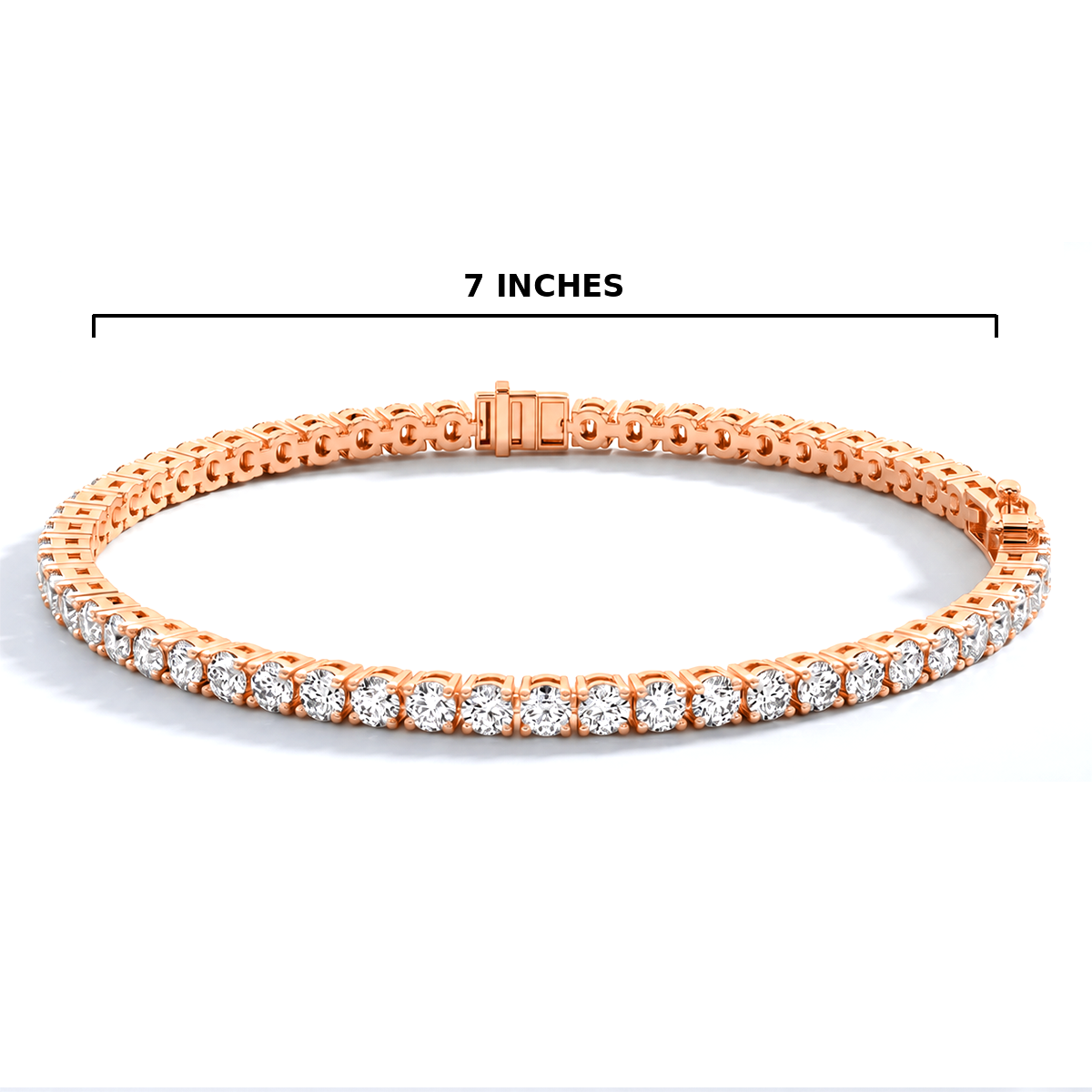 A rose gold tennis bracelet with clear gemstones, shown on a white background with a black measurement line indicating a width of 7 inches.