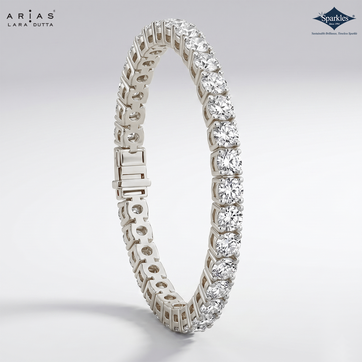 Diamond bracelet on a light gray background with Arias and Sparkles branding.