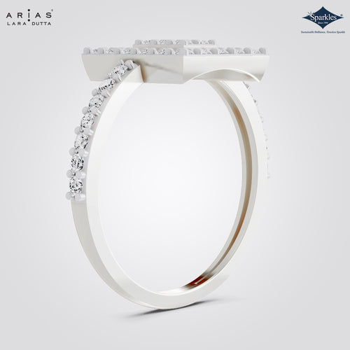 A white gold or platinum square solitaire ring with a pavé diamond top and a curved row of round diamonds along the band, shown on a light gray background. The Arias Lara Dutta logo is in the top left, and the Sparkle gemstone brand logo is in the top right.