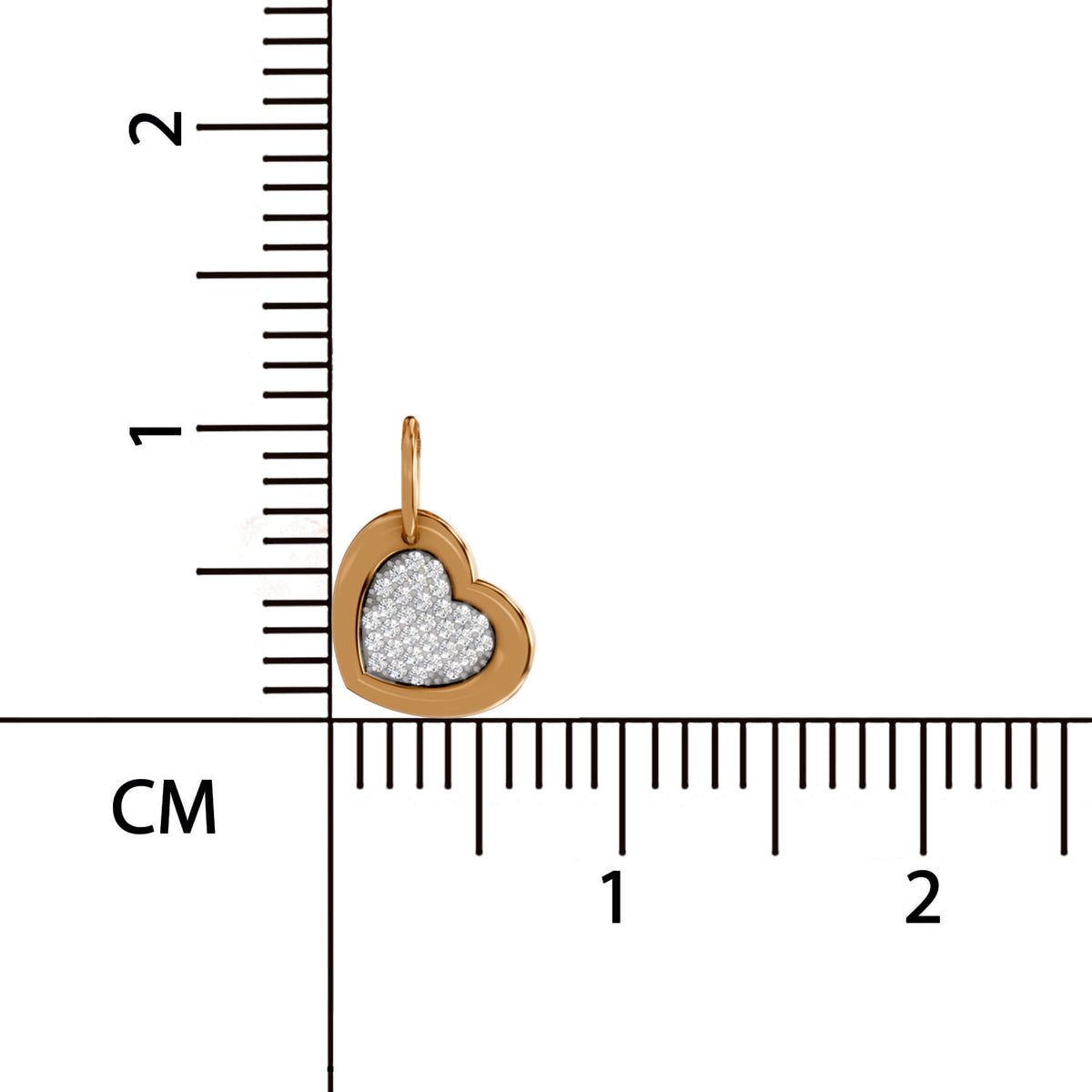 Heart-shaped pendant with glittery center on a ruler for scale