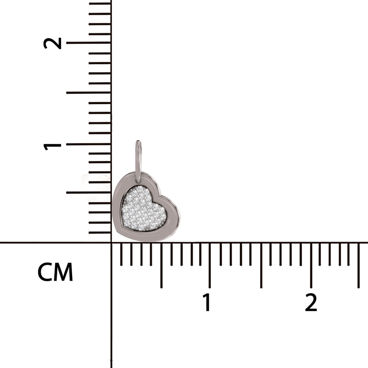 Heart-shaped pendant with textured surface on a ruler for scale