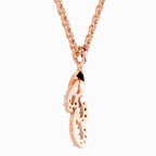 Rose gold necklace with a unique pendant on a white background