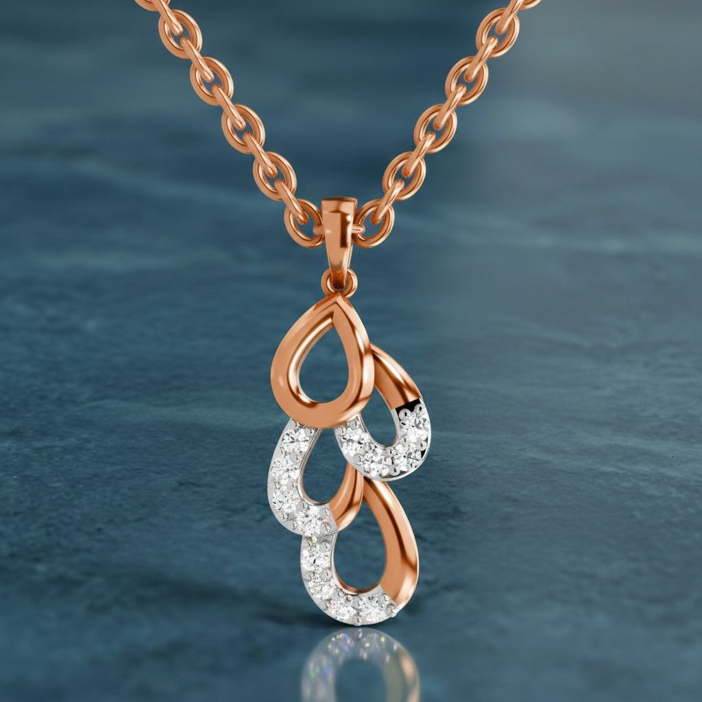 Rose gold and silver pendant necklace on a blue textured background