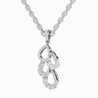 Silver necklace with a heart-shaped pendant on a white background