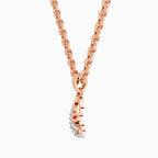 Rose gold necklace with a heart-shaped pendant on a white background
