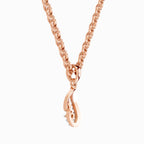 A rose gold chain necklace with a teardrop-shaped pendant featuring a small keyhole cutout, shown against a plain white background.