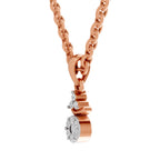 Rose gold necklace with a heart-shaped pendant on a white background