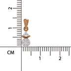 Gold and silver pendant with a clear gemstone on a white background with measurement scale.
