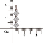 A vertical close-up of a silver-toned jewelry pendant with three clear round-cut stones, shown next to a centimeter ruler for scale on a white background.
