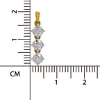 A yellow gold pendant with three round-cut clear gemstones, shown next to a centimeter ruler for scale on a white background.