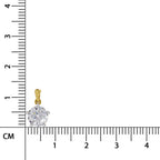 A small gold pendant with a clear round gemstone shown next to a centimeter ruler for scale on a white background.
