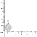Silver pendant with clear stones on a ruler for scale