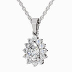 A silver-tone pendant necklace featuring a pear-cut center stone surrounded by a halo of round and marquise-cut clear stones, suspended from a matching chain on a light gray background.