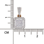 A square princess-cut diamond pendant with a halo setting, shown next to a centimeter ruler to indicate its size. The pendant features a silver-toned setting with a central clear diamond and a border of smaller diamonds, with a rose gold accent at the top bail.