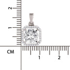 A square halo pendant with a round-cut center stone and smaller surrounding stones in a silver-toned setting, shown next to a centimeter ruler for scale on a white background.