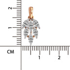 A rose gold and white gold pendant with marquise-cut clear stones, shown next to a centimeter ruler for scale on a white background.