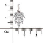 A silver-toned floral pendant with clear gemstones, shown next to a centimeter ruler for scale on a white background.