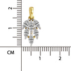 A gold and white metal pendant with marquise-cut clear stones, shown next to a centimeter ruler for scale on a white background.