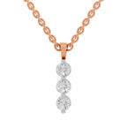 A rose gold chain necklace with a vertical dangle pendant featuring three round clear gemstones, shown against a plain white background.