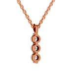 A rose gold necklace with a vertical pendant composed of three stacked oval links, each set with a small clear gemstone, shown against a plain white background.