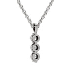 A silver-toned pendant necklace featuring three stacked oval links, each set with a small clear gemstone, suspended from a matching chain against a plain white background.