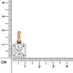 A square diamond pendant in a rose gold setting with a halo of small clear stones, shown next to a centimeter ruler for scale on a white background.