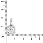 A square diamond pendant with a halo setting in silver-toned metal, shown next to a centimeter ruler for scale on a white background.