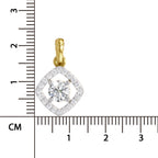 A small diamond pendant with a yellow gold bail, surrounded by a double halo of pavé-set diamonds, shown next to a centimeter ruler for scale on a white background.