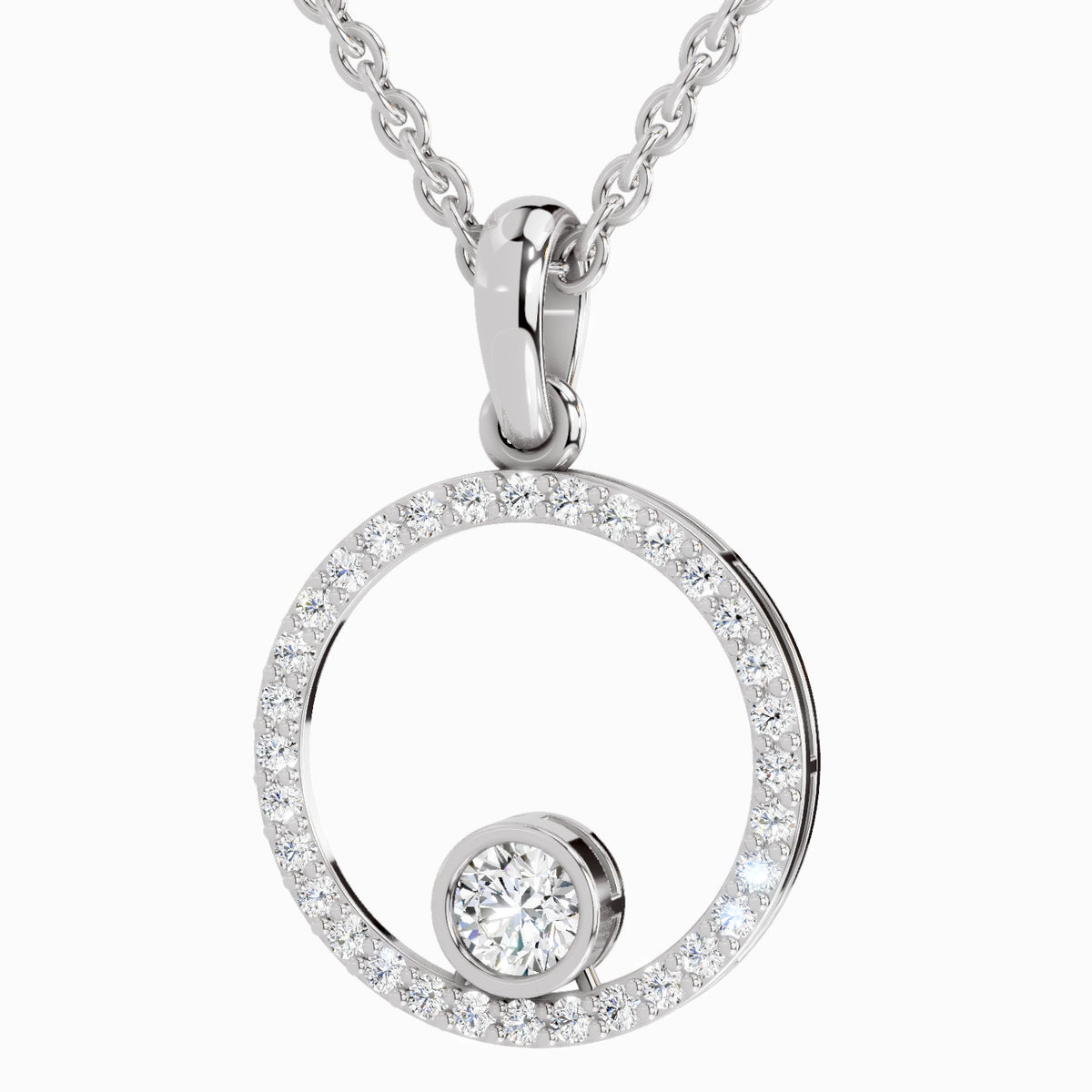 A silver-toned necklace featuring an open circular pendant encrusted with small clear stones and a smaller round clear stone at the bottom, suspended from a matching chain against a light gray background.