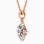Elegant rose gold floral diamond pendant necklace featuring sparkling round and marquise-cut diamonds in an intricate cluster setting, shown from a side angle on a delicate rose gold chain against a white background.
