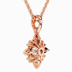 Rear view of a rose gold floral diamond pendant necklace featuring an intricate openwork setting, polished rose gold detailing, and a delicate matching chain against a clean white background.