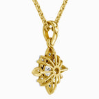 Back view of an elegant yellow gold floral diamond pendant necklace, showcasing an intricate openwork setting, polished gold detailing, and a delicate matching chain against a clean white background.