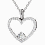 Heart-shaped diamond pendant on a white background