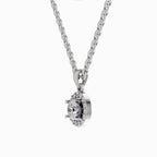 A silver-toned necklace with a curb chain and a halo pendant featuring a central iridescent gemstone, shown on a plain white background.