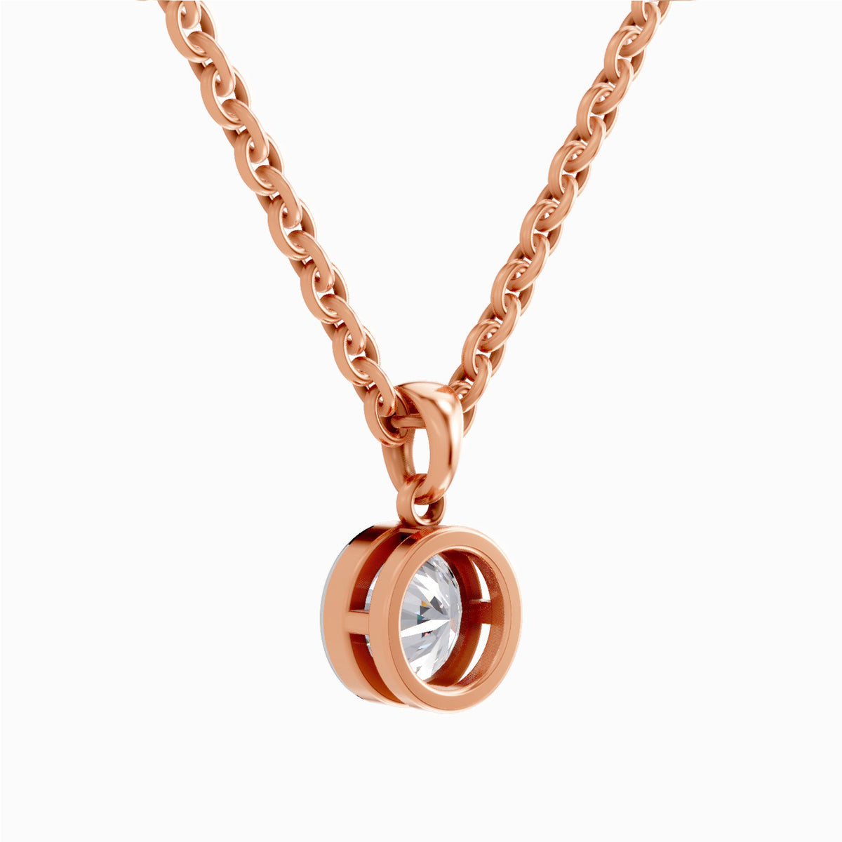 A rose gold chain necklace with a double-ring bezel pendant holding a clear round-cut gemstone, shown against a plain white background.